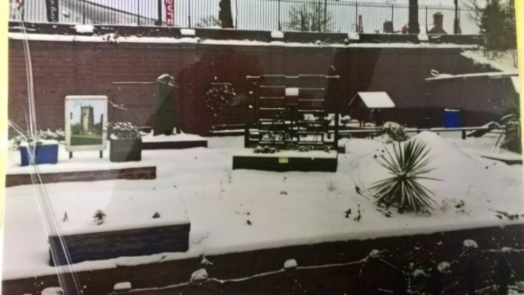 Evesham Station garden with winter snow