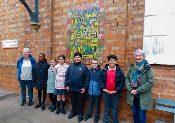 Artist, Claire Horacek (right) and Fiona Saxon (WCRP) with pupils from St. George’s Church of England Primary School.